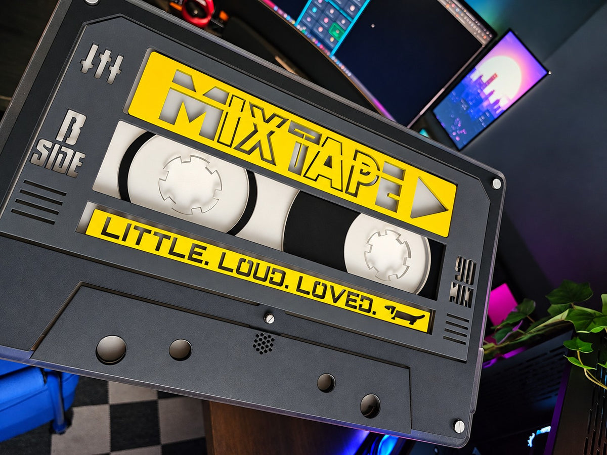 Unlit custom MIXTAPE cassette in yellow and black, angled close up