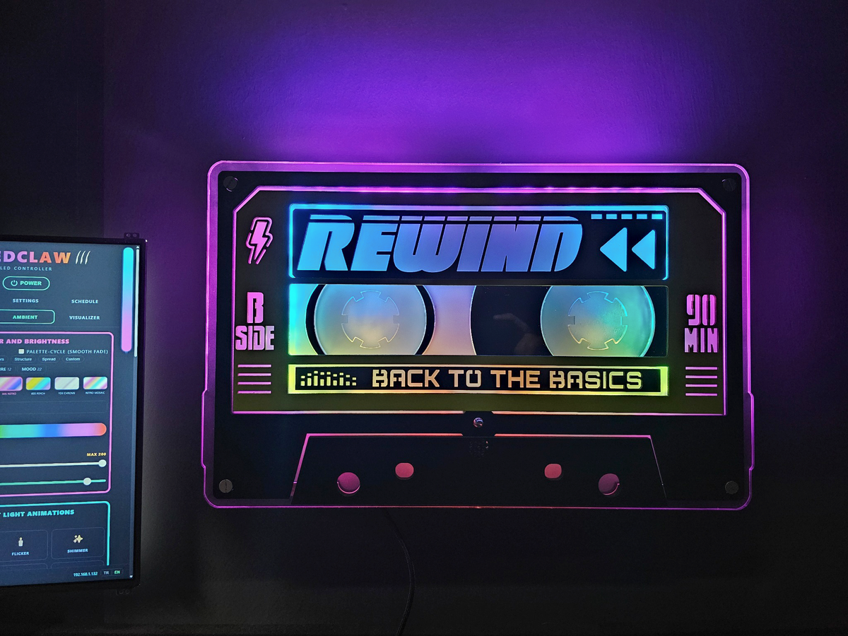 Light-up cassette in purple and blue next to the LEDCLAW controller app