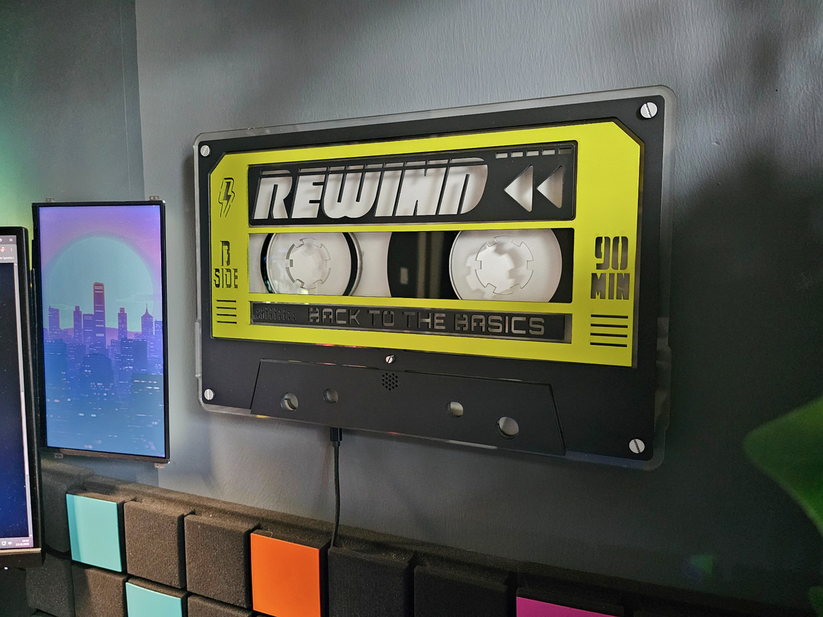 Unlit custom cassette in yellow and black on the wall