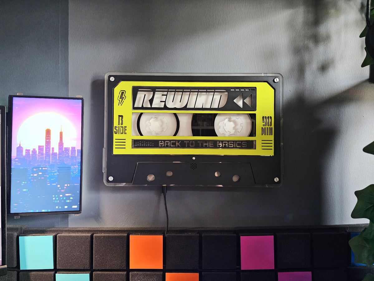 Unlit custom REWIND cassette in yellow and black, front view
