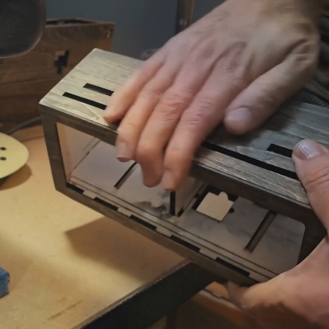 Inside the LEDCLAW workshop: a handmade case being sanded, painted and finished by hand
