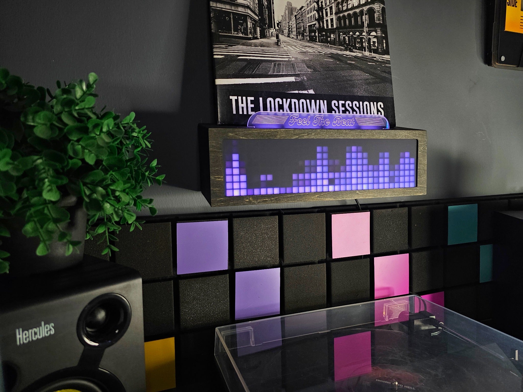 Ledclaw Vinyl Visualizer displaying colorful light with a record sleeve